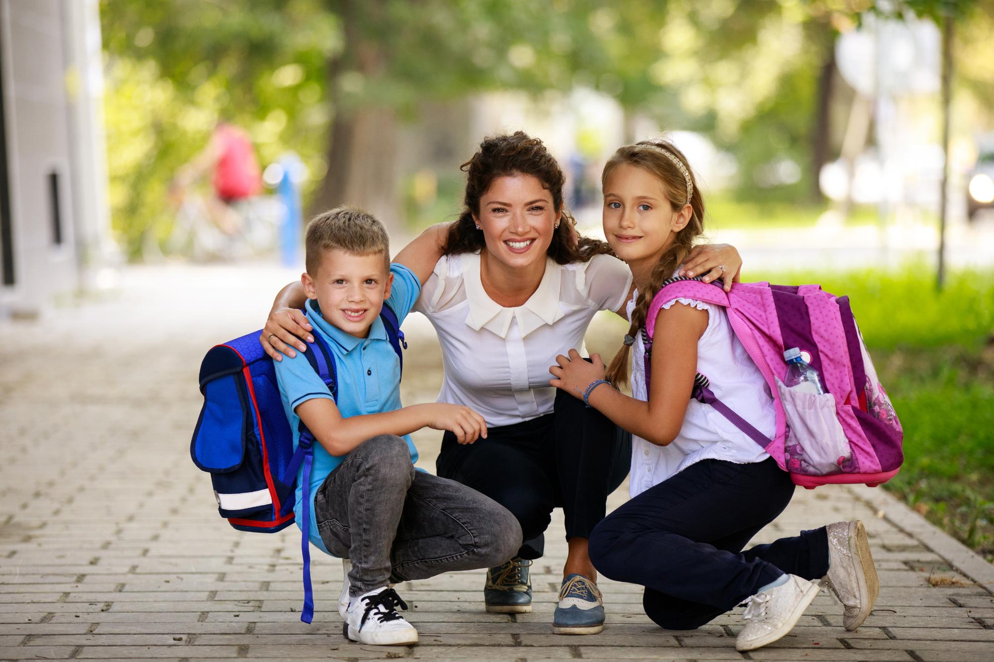 GettyImages-1036041618-mother two children school