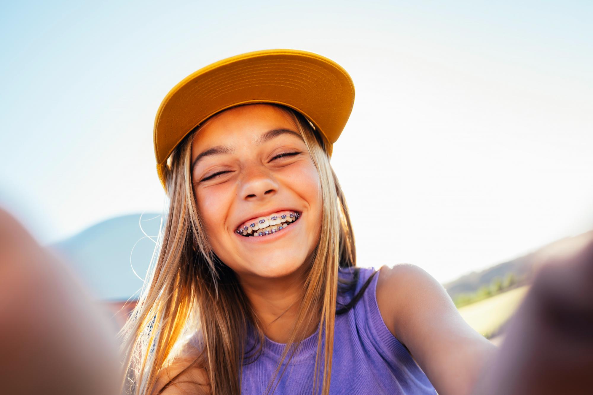 beautiful-teen-girl-taking-selfies-in-a-yellow-cap-2023-11-27-04-56-39-utc