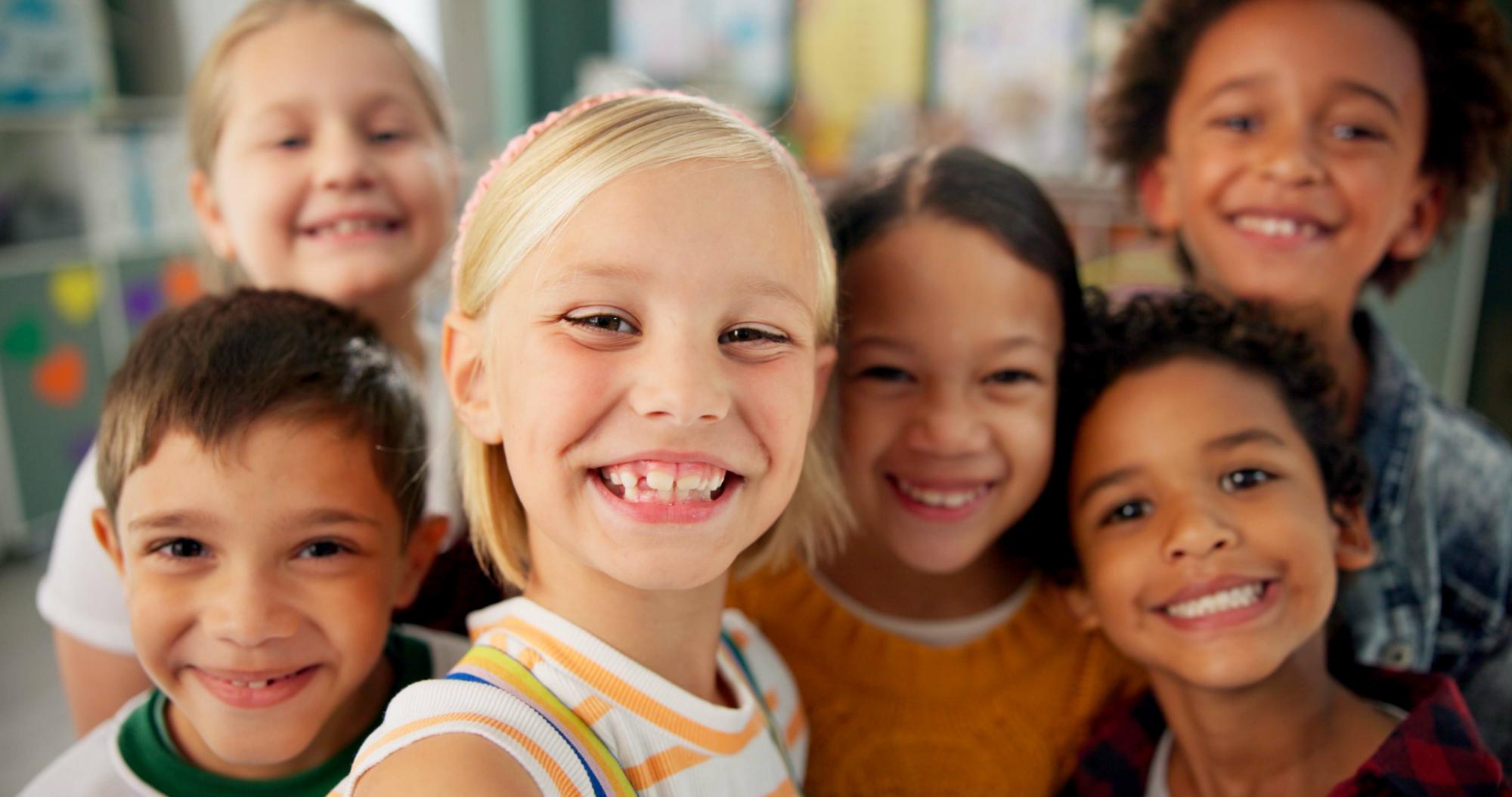 Child smiling with colorful braces at Noyce Orthodontics in St. Joseph, MO